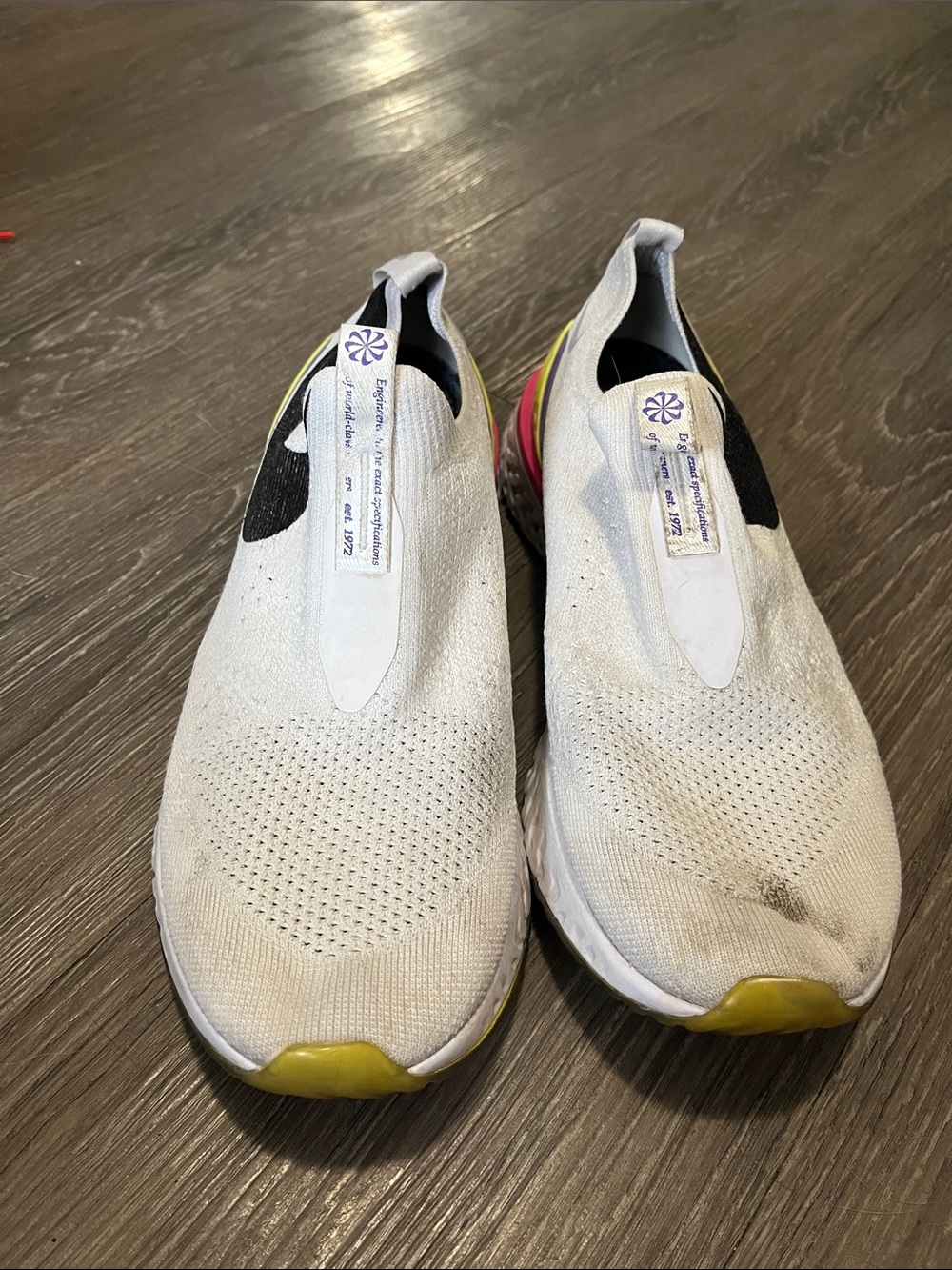 Nike White Slip-On Kids Sneakers with Yellow and Black Accents